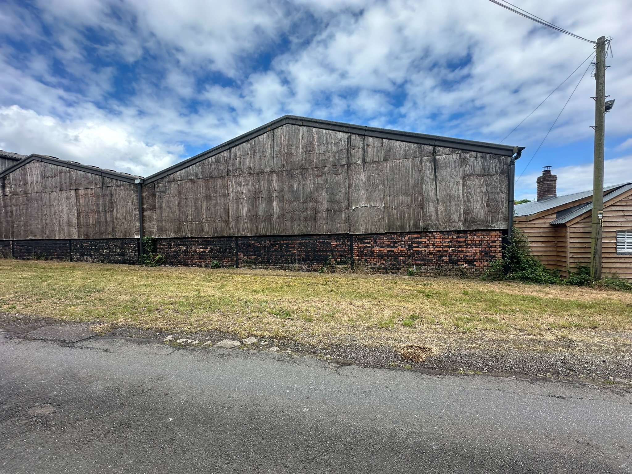 Before barn recladding showing weathered timber cladding
